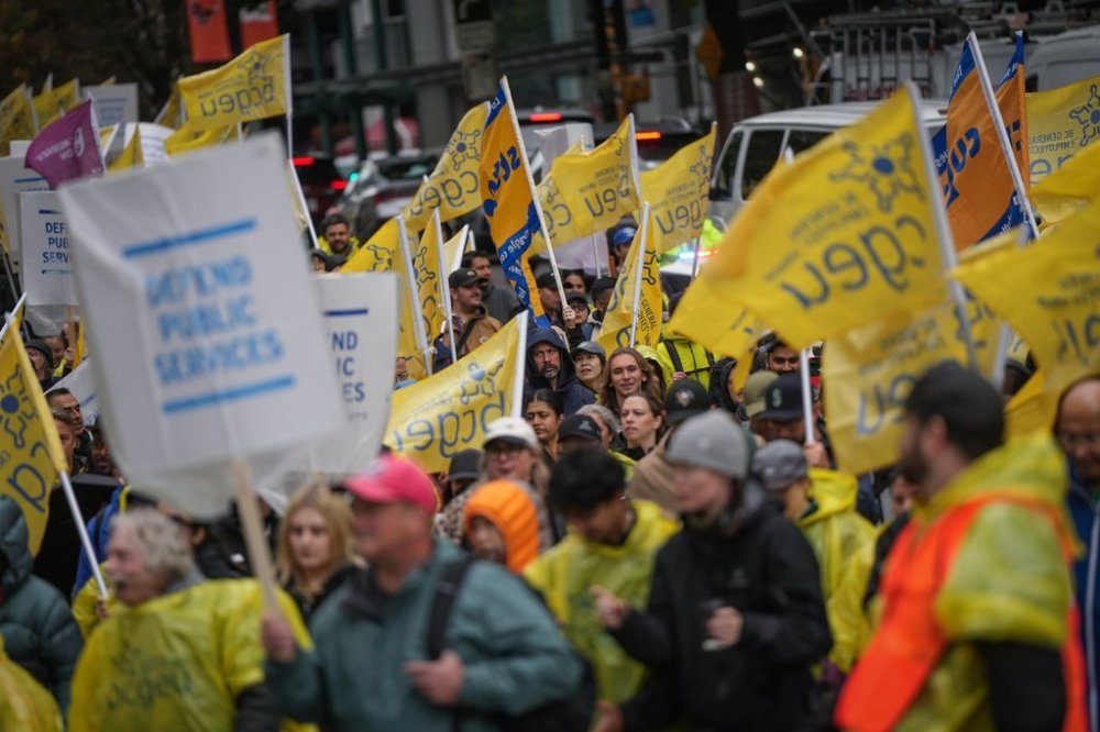 B.C. General Employees' Union (BCGEU) members and supporters march to a rally in Vancouver, on Wednesday, Oct. 1, 2025. Hundreds of British Columbia public sector workers marched through downtown Vancouver Wednesday in a push for a new contract, after talks with provincial government negotiators broke down shortly after they had resumed earlier this week. THE CANADIAN PRESS/Darryl Dyck