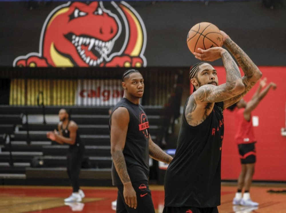Toronto Raptors' Brandon Ingram, right, shoots the basketball as RJ Barrett looks on during opening day of training camp in Calgary, Tuesday, Sept. 30, 2025. THE CANADIAN PRESS/Jeff McIntosh