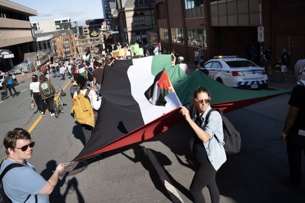 Demonstrators block a street while protesting Team Israel's participation in the Davis Cup tennis match against Team Canada in Halifax on Friday, Sept. 12, 2025. THE CANADIAN PRESS/Darren Calabrese