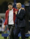 FILE - Real Madrid's head coach Zinedine Zidane is embraced by his son Luca at the end of the Champions League final soccer match between Juventus and Real Madrid at the Millennium Stadium in Cardiff, Wales, June 3, 2017. (AP Photo/Tim Ireland, file)
