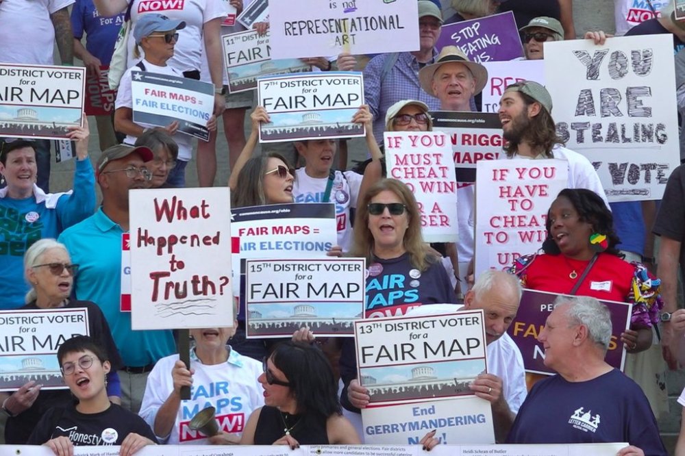 This photo taken from video shows organizers rallying outside of the Ohio Statehouse to protest gerrymandering and advocate for lawmakers to draw fair maps on Wednesday, Sept. 17, 2025, in Columbus, Ohio. (AP Photo/Patrick Aftoora-Orsagos)