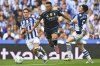 Real Madrid's Kylian Mbappe, centre, in action between Real Sociedad's Jon Gorrotxategi, left, and Real Sociedad's Igor Zubeldia during the La Liga soccer match between Real Sociedad and Real Madrid at the Reale Arena in San Sebastian, Spain, Saturday, Sept. 13, 2025. (AP Photo/Miguel Oses)