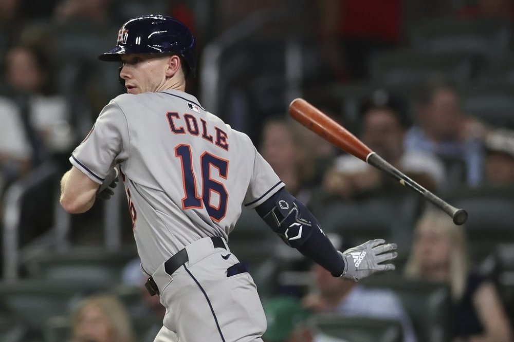 Houston Astros' Zach Cole flips away his bat after hitting an RBI single in the fourth inning of a baseball game against the Atlanta Braves, Friday, Sept. 12, 2025, in Atlanta. (AP Photo/Colin Hubbard)