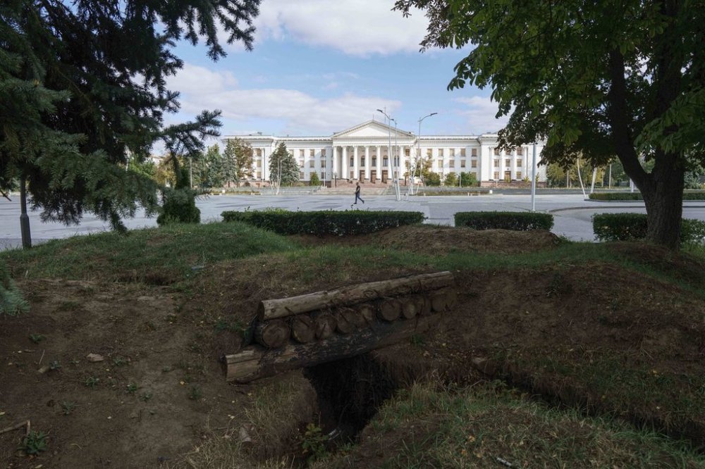 A man walks past a central square in Kramatorsk, Ukraine, Friday, Sept. 5, 2025. (AP Photo/Evgeniy Maloletka)
