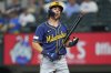 Milwaukee Brewers' Sal Frelick reacts after being called out on strikes against the Texas Rangers during the first inning of a baseball game Wednesday, Sept. 10, 2025, in Arlington, Texas. (AP Photo/Julio Cortez)