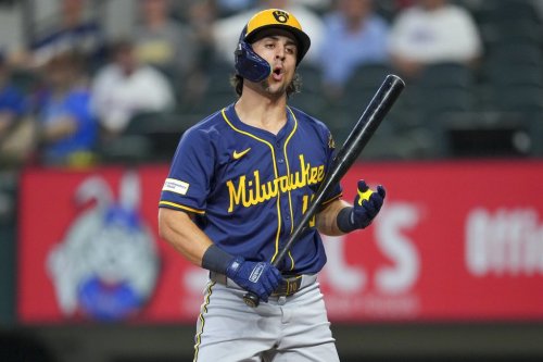Milwaukee Brewers' Sal Frelick reacts after being called out on strikes against the Texas Rangers during the first inning of a baseball game Wednesday, Sept. 10, 2025, in Arlington, Texas. (AP Photo/Julio Cortez)
