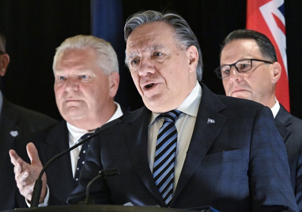 Quebec Premier François Legault speaks at a closing news conference following a meeting of Great Lakes premiers and governors in Quebec City, Monday, Oct. 6, 2025. Ontario Premier Doug Ford, left, and Pennsylvania Governor Josh Shapiro, right, look on. THE CANADIAN PRESS/Jacques Boissinot