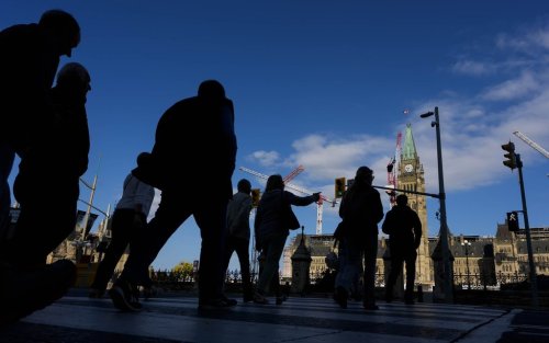 People cross Wellington Street on their way to Parliament Hill, a day before the return of the House of Commons, on Sunday, Sept. 14, 2025. THE CANADIAN PRESS/Justin Tang