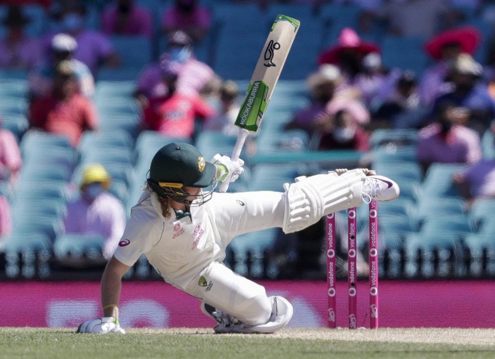 FILE - Australia's Will Pucovski falls while batting during play on day three of the third cricket test between India and Australia at the Sydney Cricket Ground, Sydney, Australia, on Jan. 9, 2021. (AP Photo/Rick Rycroft, File)