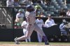 Texas Rangers' Adolis García hits an RBI single during the seventh inning of a baseball game against the Athletics, Sunday, Aug. 31, 2025, in West Sacramento, Calif. (AP Photo/Sara Nevis)