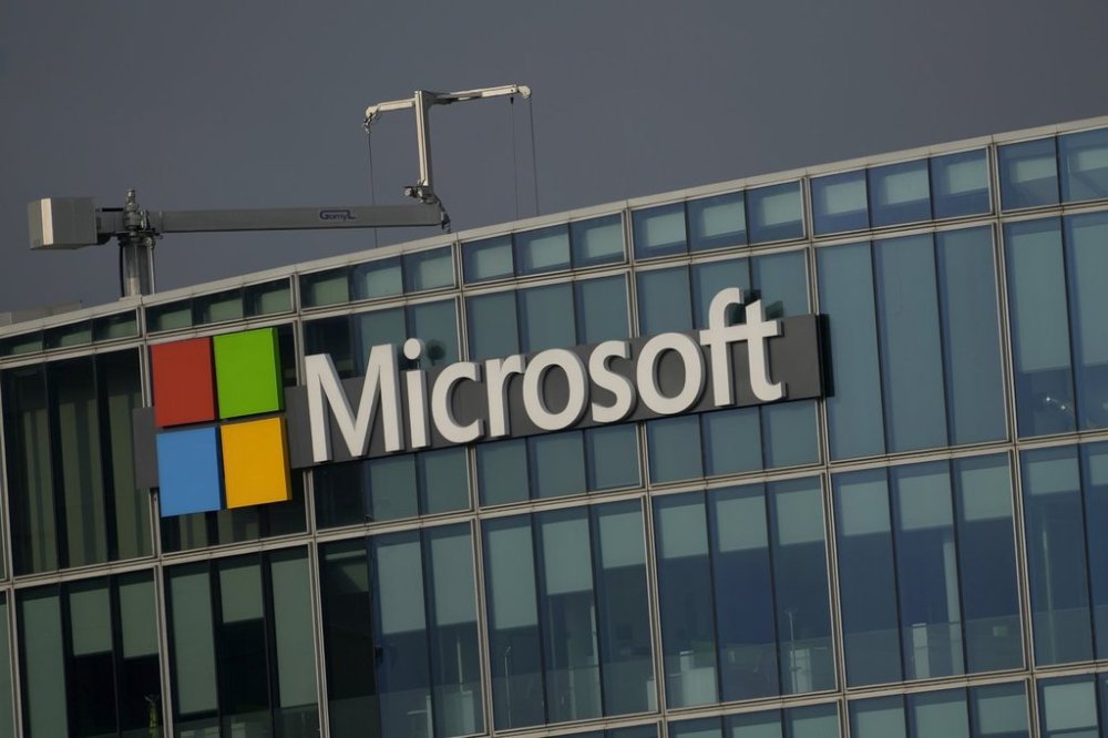 FILE - The logo of Microsoft is seen outside its French headquarters in Issy-les-Moulineaux, outside Paris, on May 13, 2024. (AP Photo/Thibault Camus, File)