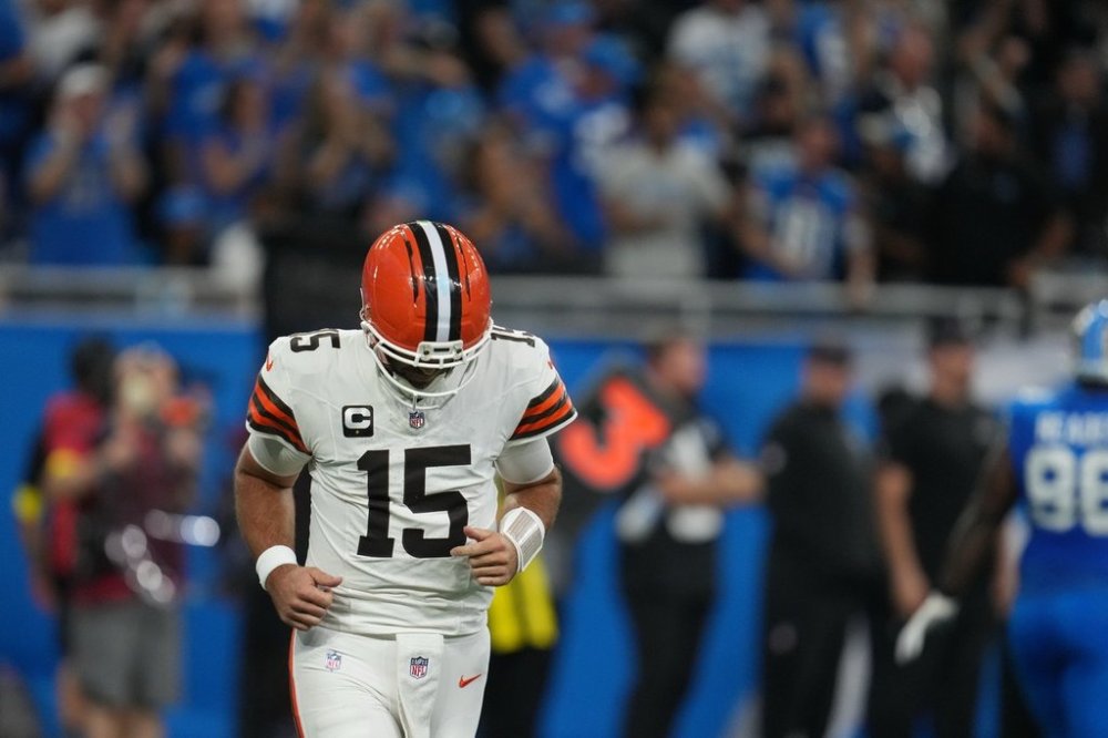 Cleveland Browns quarterback Joe Flacco (15) runs off the field after throwing an interception during the first half of an NFL football game against the Detroit Lions, Sunday, Sept. 28, 2025, in Detroit. (AP Photo/Paul Sancya)