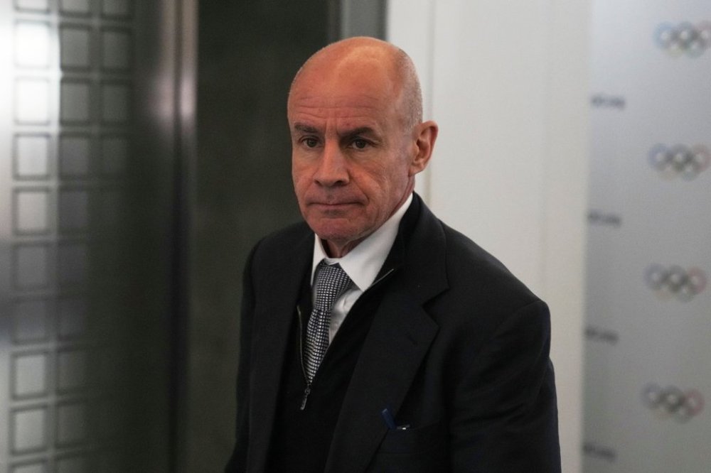 FILE - Candidate to the presidency of the International Olympic Committee Johan Eliasch arrives at the mixed zone during a break of the 144th session, which will elect the new IOC President, in Costa Navarino, western Greece, March 19, 2025. (AP Photo/Thanassis Stavrakis, File)