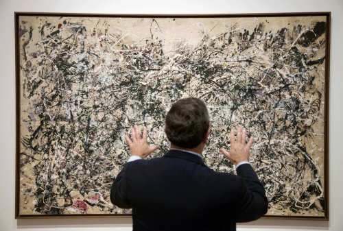FILE - David Brenneman, director of collections and exhibitions at the High Museum, talks about Jackson Pollock's painting 