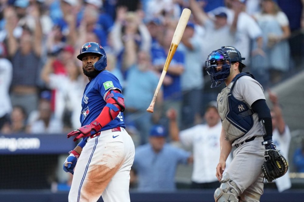 Blue Jays first baseman Vladimir Guerrero Jr. flips his bat after hitting a grand slam in the fourth inning of MLB American League Division Series action against the New York Yankees in Toronto on Oct. 5, 2025. THE CANADIAN PRESS/Nathan Denette