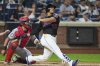 Washington Nationals catcher Jorge Alfaro, left, watches as New York Mets' Juan Soto hits a three-run home run during the fourth inning of a baseball game Friday, Sept. 19, 2025, in New York. (AP Photo/Frank Franklin II)