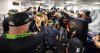 The Detroit Tigers celebrate in the locker room after defeating the Boston Red Sox and clinching a spot in the playoffs, Saturday, Sept. 27, 2025, in Boston. (AP Photo/Mark Stockwell)