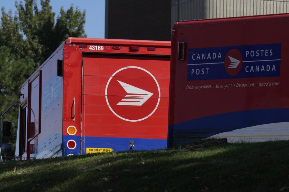 Canada Post vehicles are seen at a facility in Ottawa, Friday, Sept. 12, 2025. THE CANADIAN PRESS/Adrian Wyld