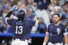 Kansas City Royals' Salvador Perez (13) celebrates as he crosses the plate after hitting a three-run home run during the first inning of a baseball game against the Toronto Blue Jays, Friday, Sept. 19, 2025, in Kansas City, Mo. (AP Photo/Charlie Riedel)