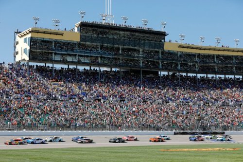 Drivers head toward Turn 1 at the start of a NASCAR Cup Series auto race at Kansas Speedway in Kansas City, Kan., Sunday, Sept. 28, 2025. (AP Photo/Colin E. Braley)