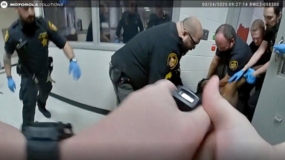 This image taken from video released by the Montgomery County Sheriff's Office shows law enforcement apprehending Christian Black inside the Montgomery County Jail on March 24, 2025, in Dayton, Ohio. (Montgomery County Sheriff's Office via AP)