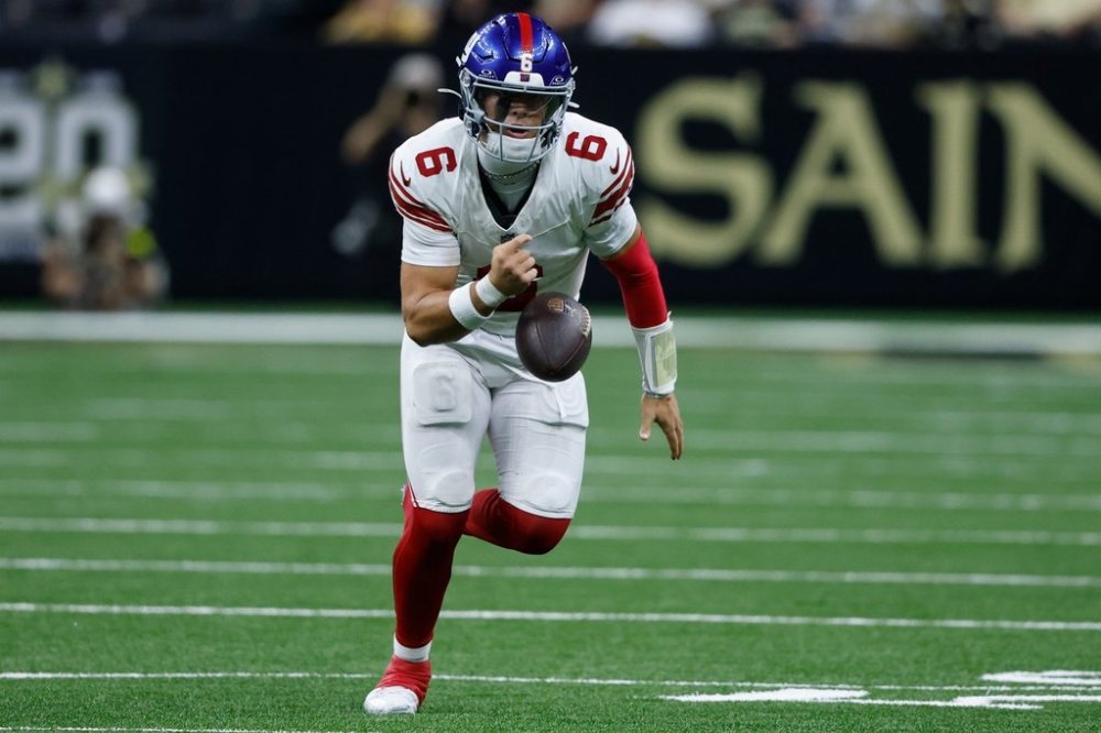 New York Giants quarterback Jaxson Dart (6) fumbles the ball against the New Orleans Saints in the second half of an NFL football game, Sunday, Oct. 5, 2025, in New Orleans.(AP Photo/Butch Dill)