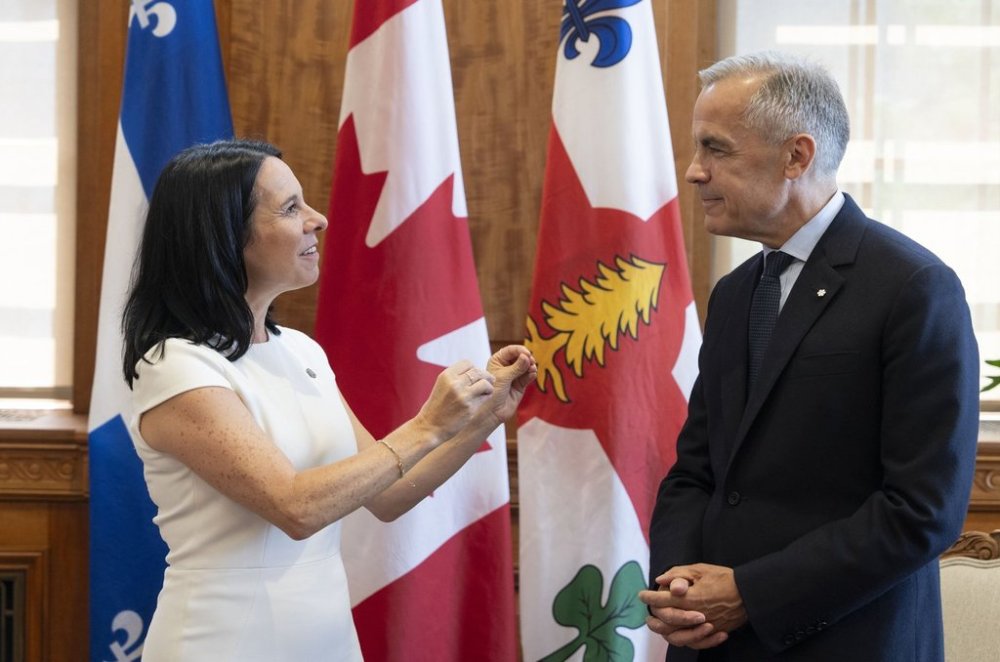 Montreal Mayor Valérie Plante poses with Prime Minister Mark Carney prior to a bilateral meeting at City Hall in Montreal on Wednesday, Aug. 20, 2025. THE CANADIAN PRESS/Christinne Muschi