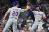 New York Mets' Francisco Lindor (12) celebrates with Pete Alonso (20) after hitting a solo home run during the third inning of a baseball game against the Chicago Cubs in Chicago, Thursday, Sept. 25, 2025. (AP Photo/Nam Y. Huh)