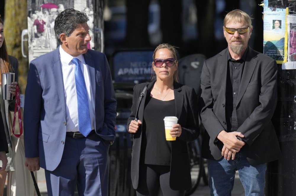 Freedom Convoy organizer Tamara Lich is seen with her lawyer Lawrence Greenspon outside the courthouse in Ottawa on Wednesday, July 23, 2025. THE CANADIAN PRESS/Adrian Wyld
