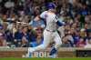 Chicago Cubs' Ian Happ (8) hits a two-run double during the second inning of a baseball game against the New York Mets, Tuesday, Sept. 23, 2025, in Chicago. (AP Photo/Erin Hooley)