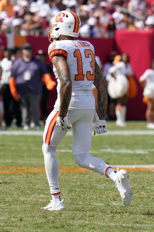 Tampa Bay Buccaneers wide receiver Mike Evans grabs his leg after getting injured during the second half of an NFL football game against the New York Jets Sunday, Sept. 21, 2025, in Tampa, Fla. (AP Photo/Chris O'Meara)