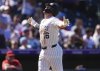 Colorado Rockies' Blaine Crim gestures as he crosses home plate after hitting a solo home run off Los Angeles Angels starting pitcher Caden Dana in the fourth inning of a baseball game Sunday, Sept. 21, 2025, in Denver. (AP Photo/David Zalubowski)