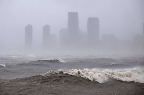 In this photo released by Xinhua News Agency, strong waves are seen ahead of Typhoon Matmo near the coastal downtown area of Haikou, in southern China's Hainan Province on Sunday, Oct. 5, 2025. (Guo Cheng/Xinhua via AP)