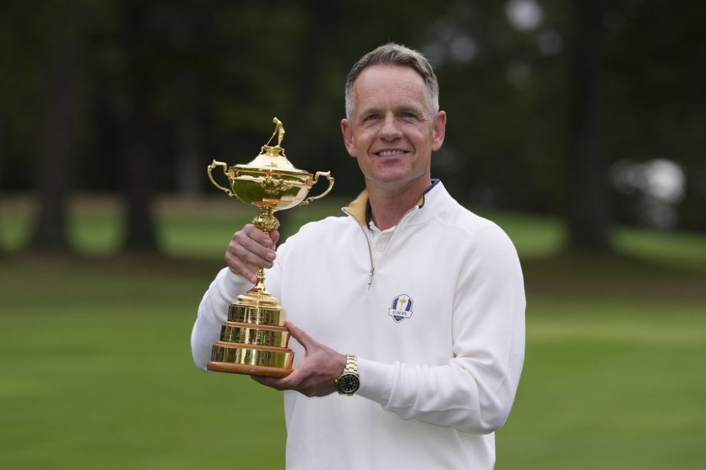 2025 European Ryder Cup Captain, Luke Donald poses with the trophy before a practice round for the Ryder Cup golf tournament, Tuesday, Sept. 23, 2025, in Farmingdale, N.Y., at Bethpage State Park's Black Course. (AP Photo/Matt Slocum)