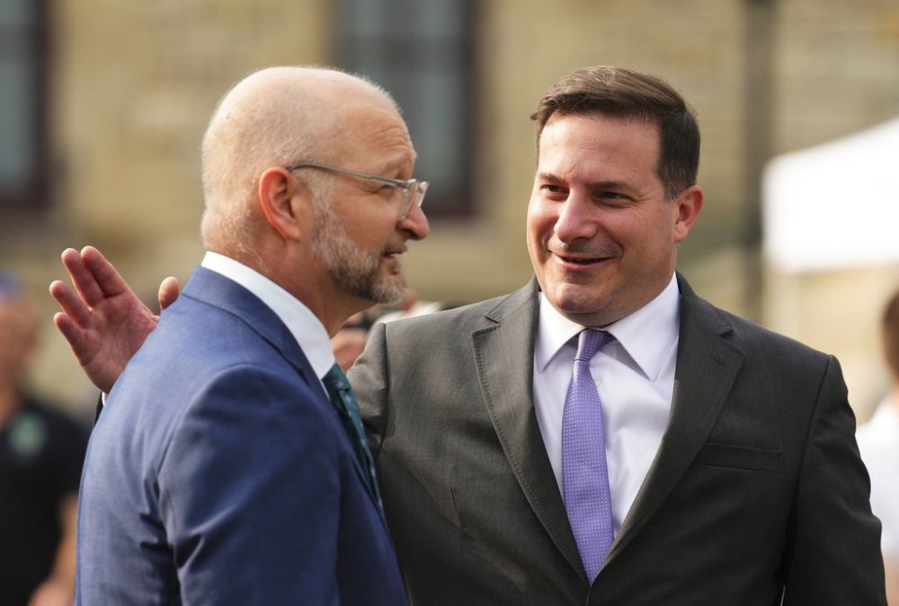 Minister of Justice and Attorney General of Canada David Lametti, left and Minister of Public Safety Marco Mendicino speak at an event on Parliament Hill in Ottawa, Wednesday, June 21, 2023. THE CANADIAN PRESS/Sean Kilpatrick