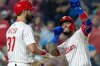 Philadelphia Phillies' Edmundo Sosa, right, celebrates with Weston Wilson (37) after hitting a two run homer in the fifth inning of a baseball game against the Miami Marlins, Wednesday, Sept. 24, 2025, in Philadelphia. (AP Photo/Laurence Kesterson)