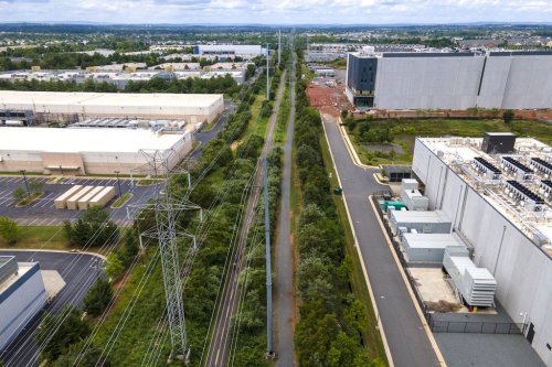 FILE - High-voltage transmission lines provide electricity to data centers in Ashburn in Loudon County, Virginia, on Sunday, July 16, 2023. (AP Photo/Ted Shaffrey, File)