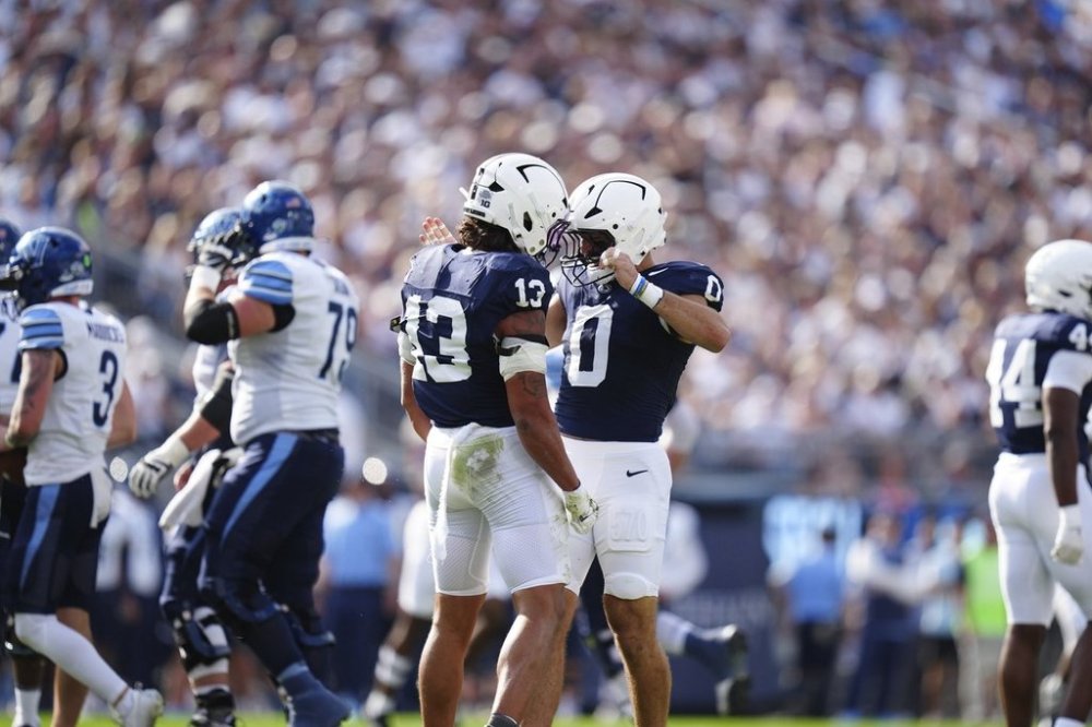 Penn State linebacker Tony Rojas (13) and linebacker Dominic DeLuca (0) celebrate a tackle during the first half of an NCAA college football game against Villanova, Saturday, Sept. 13, 2025, in State College, Pa. (AP Photo/Jared Freed)