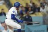 Los Angeles Dodgers' Max Muncy yells as he flies out during the eighth inning of a baseball game against the Colorado Rockies, Monday, Sept. 8, 2025, in Los Angeles. (AP Photo/Mark J. Terrill)