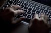 A woman uses a keyboard in North Vancouver, B.C., Wednesday, Dec. 19, 2012. THE CANADIAN PRESS/Jonathan Hayward
