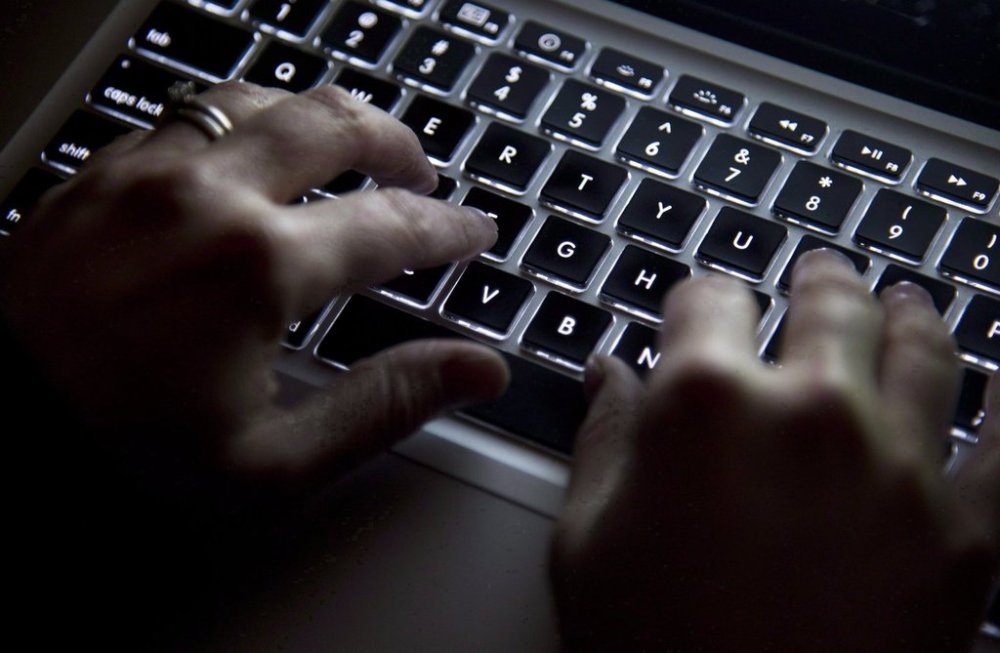 A woman uses a keyboard in North Vancouver, B.C., Wednesday, Dec. 19, 2012. THE CANADIAN PRESS/Jonathan Hayward