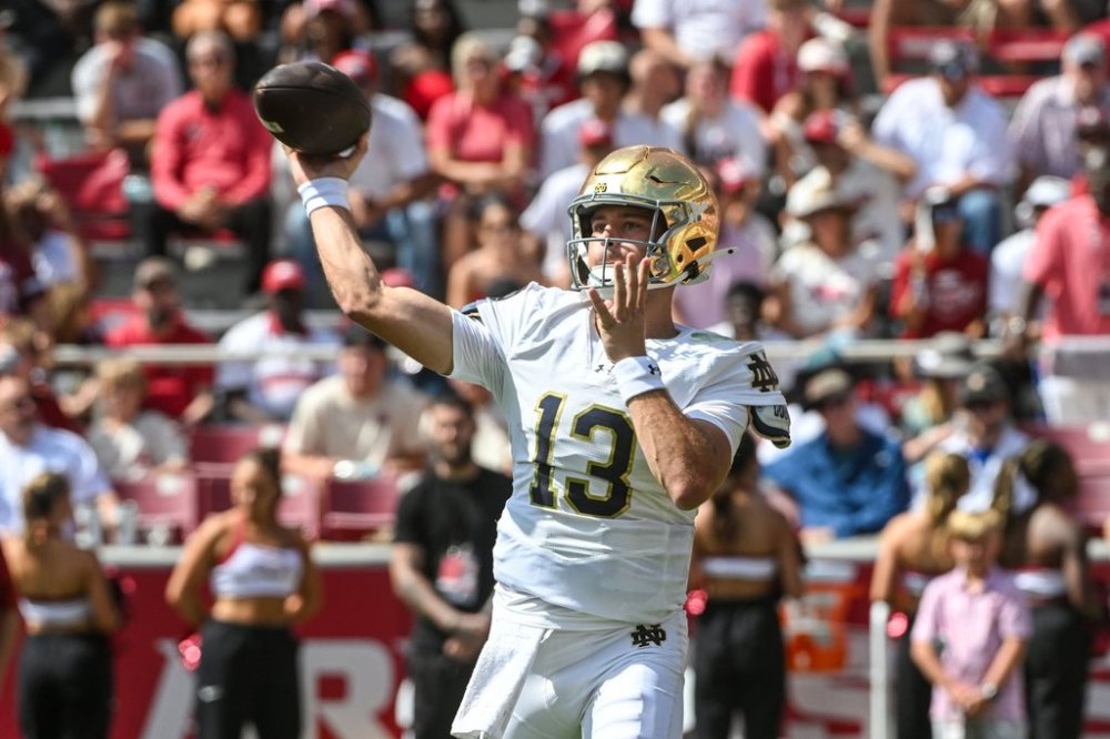 Notre Dame quarterback CJ Carr (13) throws a pass against Arkansas during the first half of an NCAA college football game Saturday, Sept. 27, 2025, in Fayetteville, Ark. (AP Photo/Michael Woods)