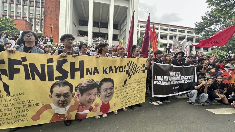 FILE - Hundreds of students at the University of the Philippines walk out of their classes and protest against corruption in government projects in Manila, Philippines, Friday, Sept.12, 2025. (AP Photo/Joeal Calupitan, File)