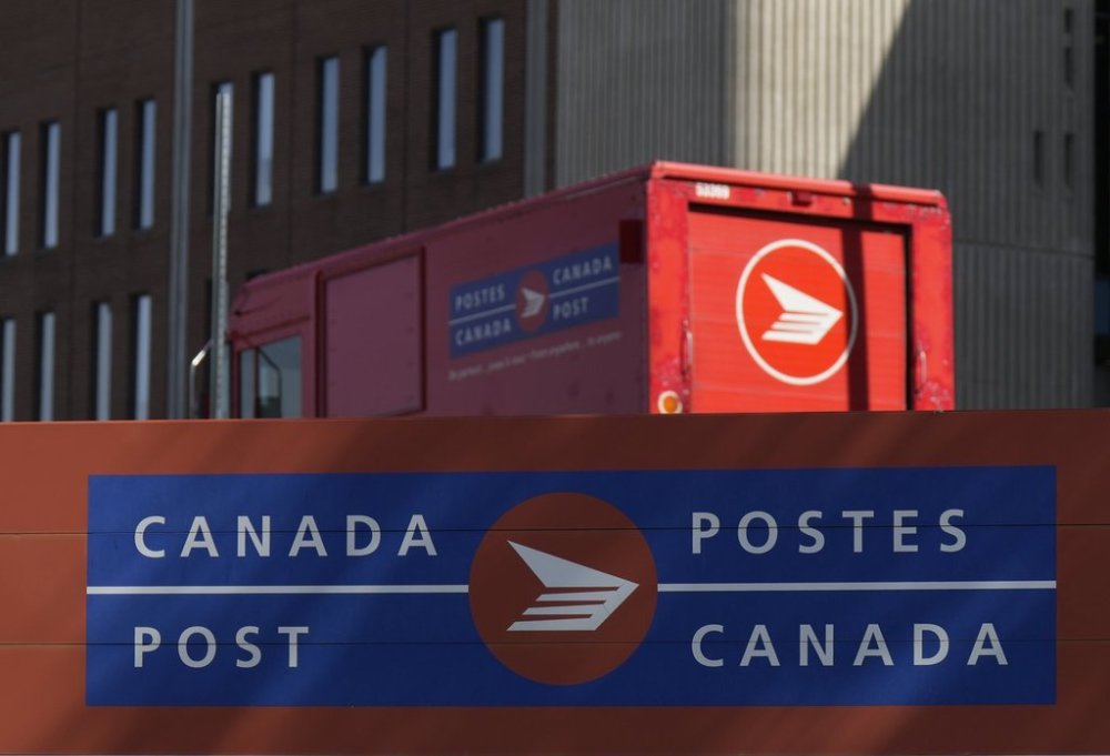 A Canada Post vehicle sits outside a facility in Ottawa, Friday, Sept. 12, 2025. THE CANADIAN PRESS/Adrian Wyld
