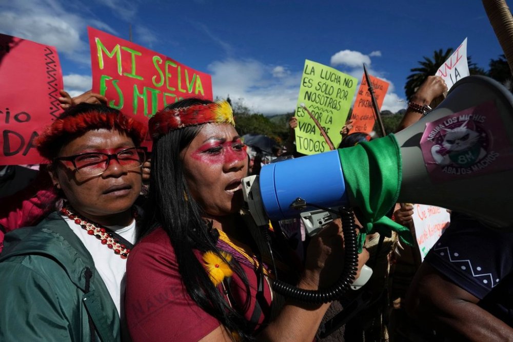 FILE - Waorani Indigenous people march to the Constitutional Court to protest for their right to consultation before the bidding for the exploration and exploitation of oil and gas on their territory in Quito, Ecuador, May 13, 2025. (AP Photo/Dolores Ochoa, File)