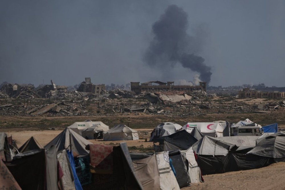 Smoke rises to the sky following an Israeli military strike in Gaza City, as seen from the central Gaza Strip, Thursday, Oct. 2, 2025. (AP Photo/Abdel Kareem Hana)