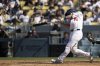 Los Angeles Dodgers' Will Smith hits a walkoff home run during the ninth inning of a baseball game against the Arizona Diamondbacks in Los Angeles, Sunday, Aug. 31, 2025. (AP Photo/Kyusung Gong)