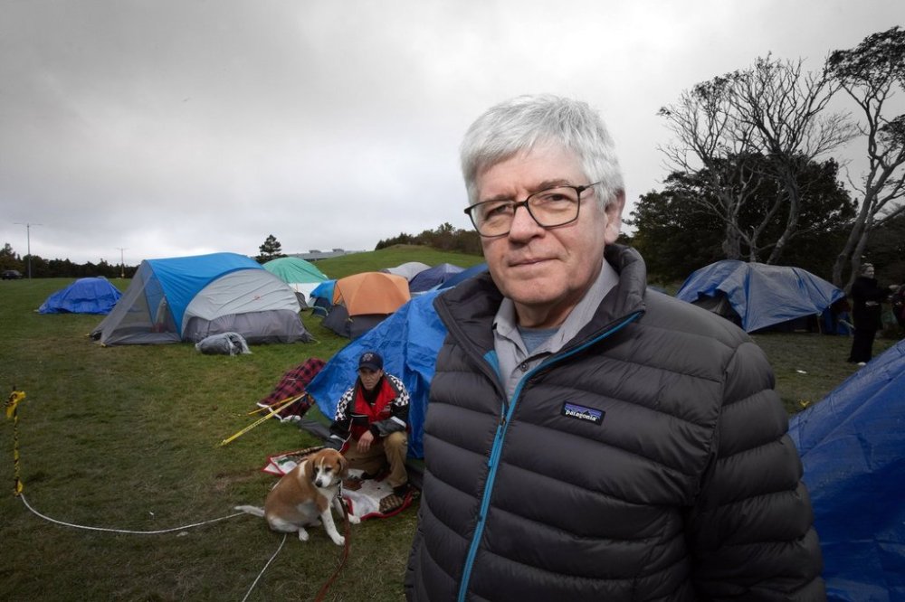 Newfoundland and Labrador NDP Leader Jim Dinn visits an encampment on Oct. 11, 2023, that was set up across from the Confederation Building in St. John's, to bring attention to the lack of affordable housing. THE CANADIAN PRESS/Paul Daly