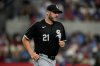 FILE - Chicago White Sox pitching coach Ethan Katz jogs off the field during a baseball game against the Texas Rangers, Tuesday, July 23, 2024, in Arlington, Texas. (AP Photo/Tony Gutierrez,File)