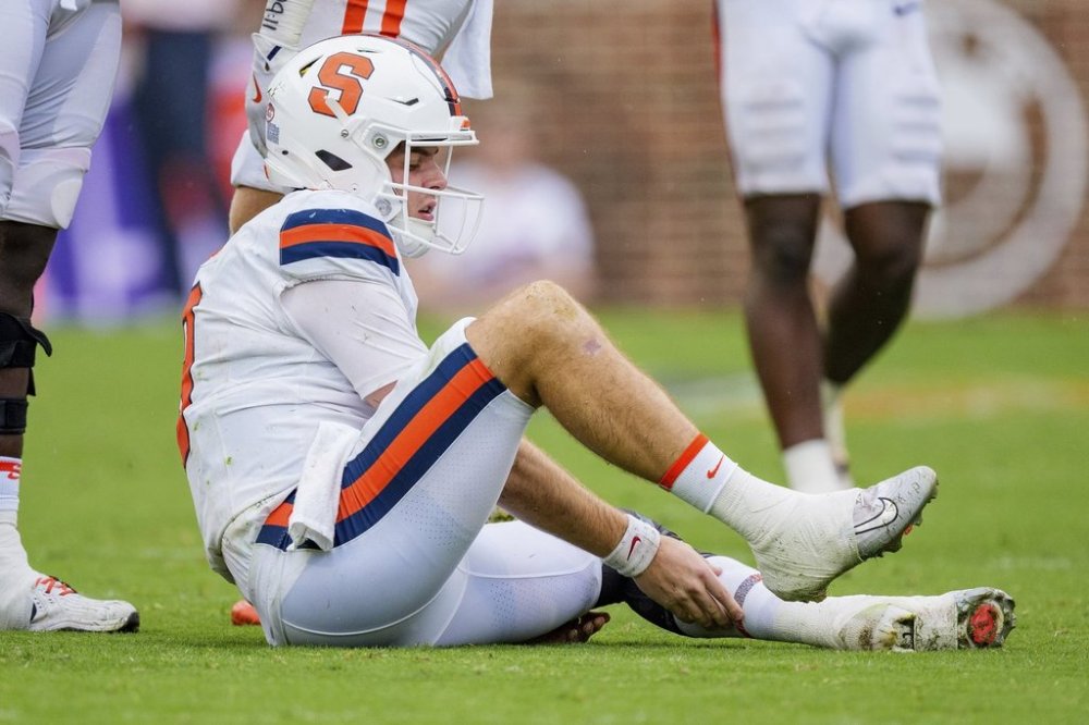 Syracuse quarterback Steve Angeli sits injured in the second half of an NCAA college football game against Clemson, Saturday, Sept. 20, 2025, in Clemson, S.C. (AP Photo/Jacob Kupferman)
